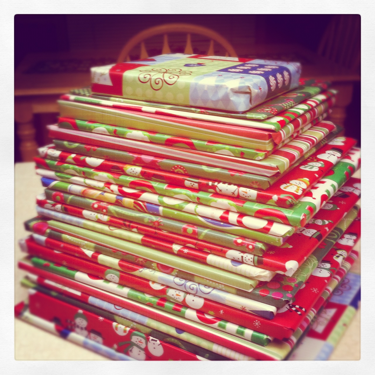 25 books wrapped and stacked