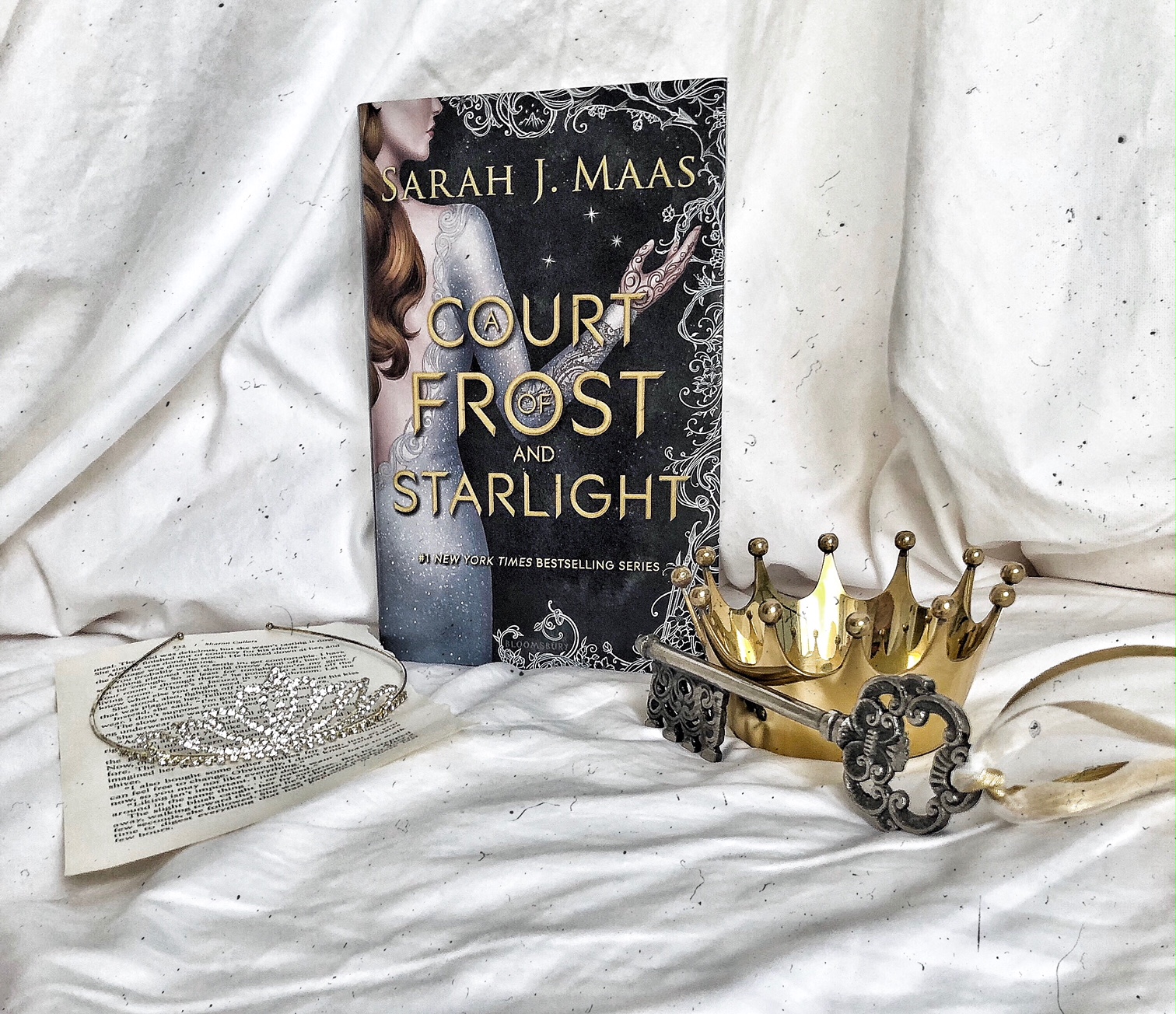 book review: a court of frost and starlight by sarah j. maas